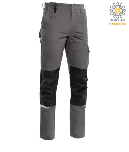 Two tone multi pocket trousers, refractive piping below the knee. Color dark grey

